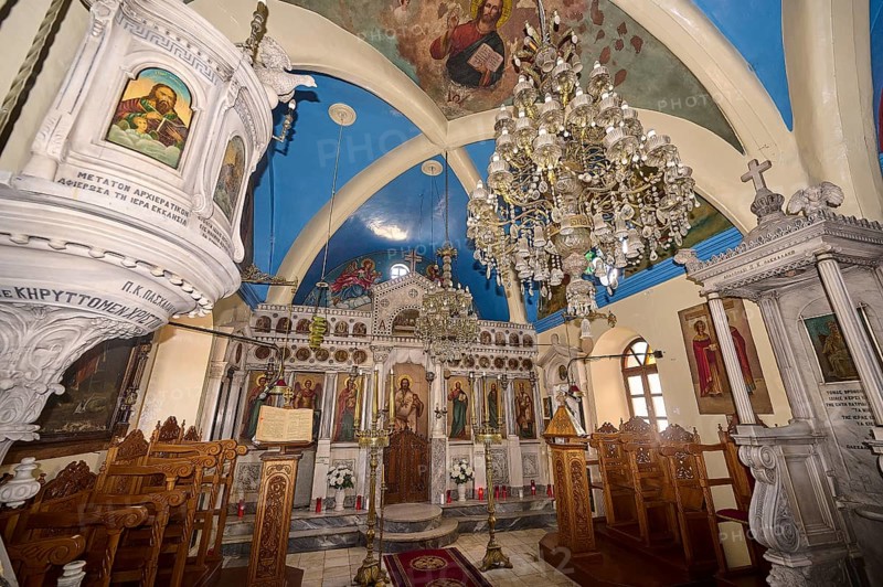 A magnificently decorated church interior with chandeliers, an ornate altar and colourful icons, Platia and Church of Issodia Theotokou, Nikia, Nisyros, Dodecanese, Greek Islands, Greece, Europe