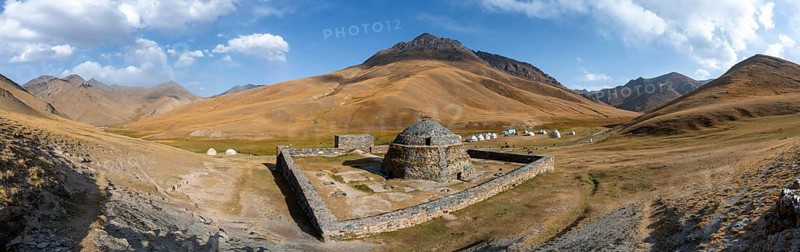 Historic caravanserai Tash Rabat from the 15th century, with yellow hills, Atbashy district in the Naryn region, Kyrgyzstan, Asia