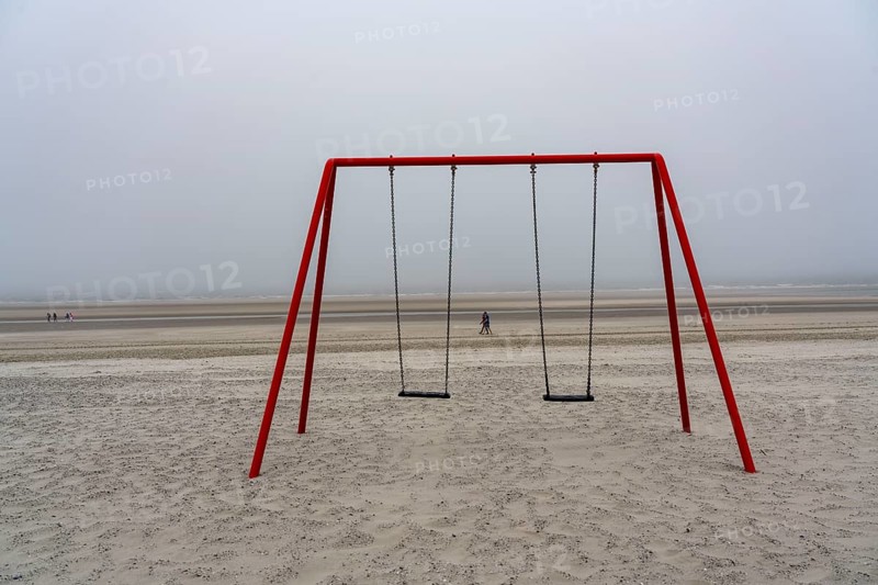 North Sea island of Langeoog, early summer, shortly after the first easing of the lockdown in the Corona crisis, foggy weather, still quite few tourists on the beach, children's swing, Lower Saxony, Germany, Europe