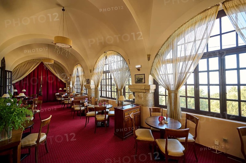 Elegant interior of a restaurant with red carpets, curtains, arched windows and table groups, Elafos Hotel, Profitis Ilias, Rhodes, Dodecanese, Greek Islands, Greece, Europe