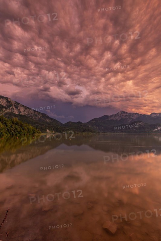 Stormy atmosphere, mountains reflected in lake, Lake Kochel, Alpine foothills, Bavaria, Germany, Europe