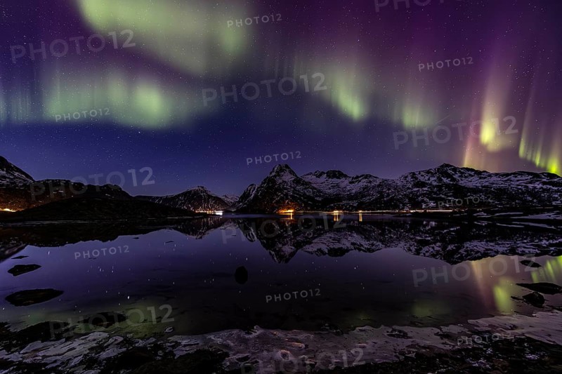 Northern lights over fjord, steep mountains, winter, aurora borealis, Flakstadoya, Lofoten, Norway, Europe