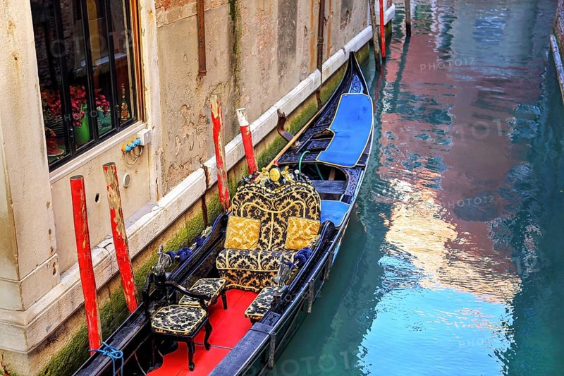 Luxury Gondola waiting for tourists near Rialto Bridge in Venice