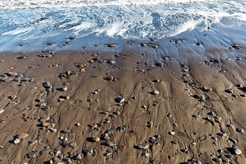 Pebbles on the black lava beach, seashore, Playa Quemada, Yaiza, Lanzarote, Spain, Europe