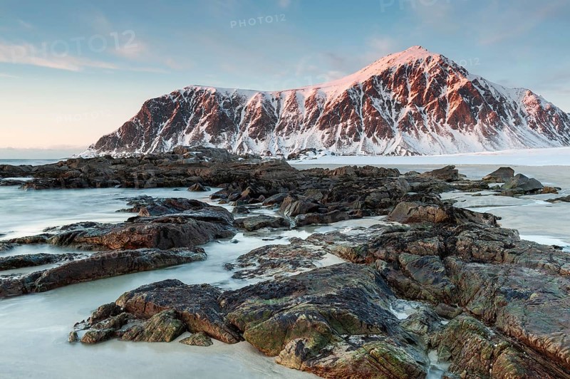 Winter evening mood at Skagsanden, rocks on the beach near Flakstad, Flakstadøy, Lofoten, Nordland, Norway, Europe