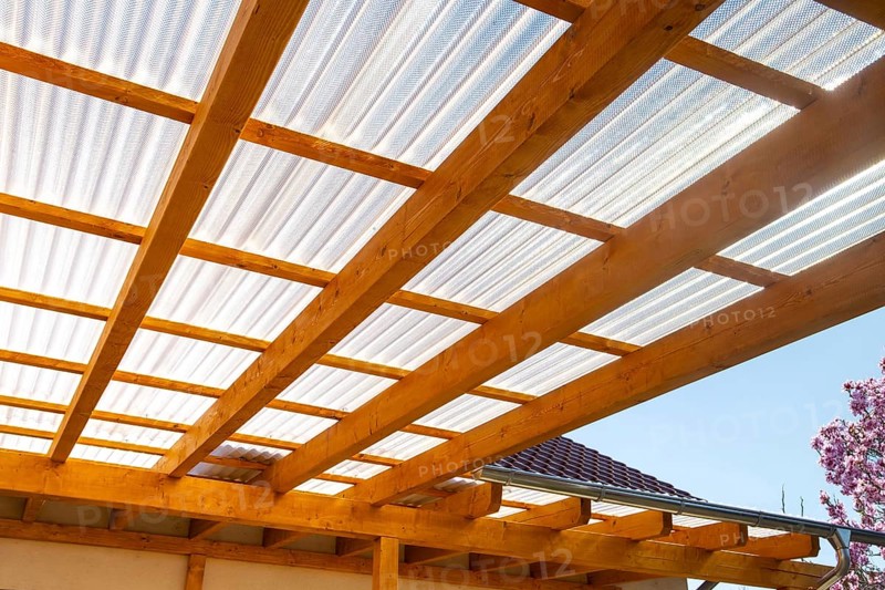 New patio roofing with wood and corrugated acrylic glass panels