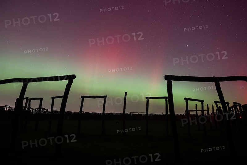 Northern lights (aurora borealis) over the ring sanctuary of Pömmelte, prehistoric circular ditch complex, also known by archaeologists as the German Stonehenge, Pömmelte, Saxony-Anhalt, Germany, Europe
