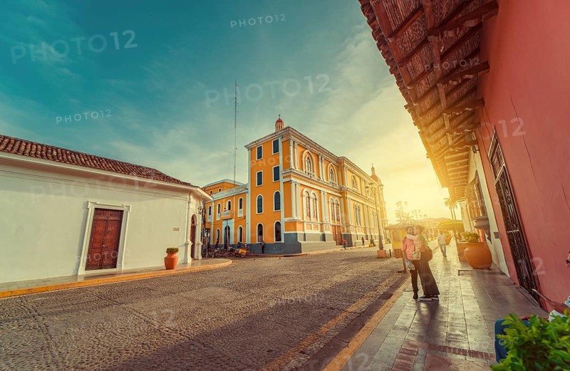 People walking through the cathedral of Granada that leads to La Calzada street. Granada, Nicaragua. 05-10-2024