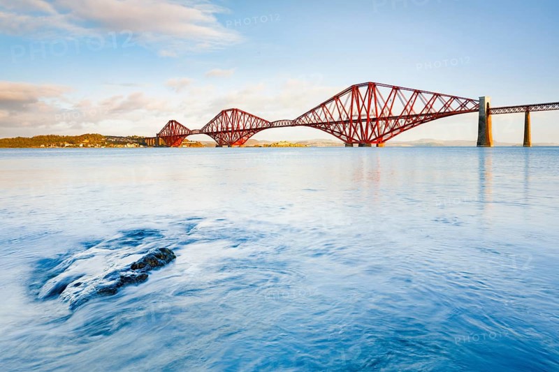 View of the red railway bridge Forth Bridge at the Fírth of Forth estuary near South Queensferry, Scotland, Great Britain