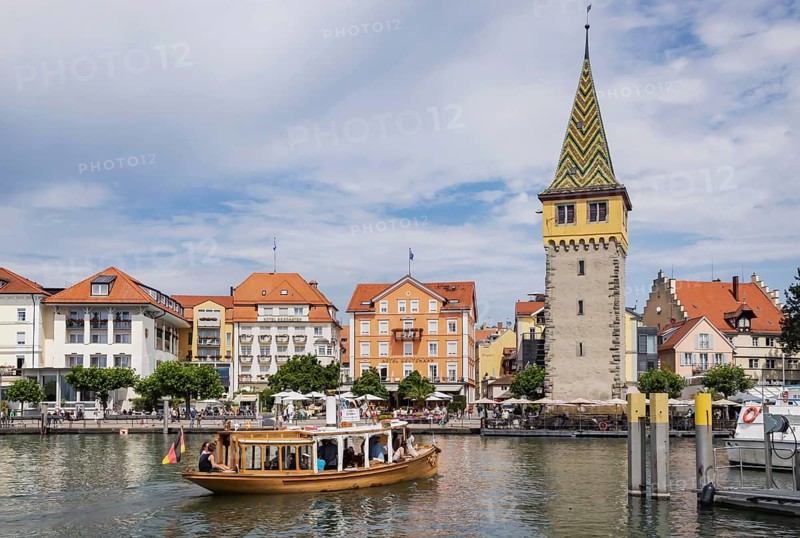 Harbour of Lindau, town view with man tower from excursion boat. Lindau, Lake Constance, Bavaria, Germany, Europe