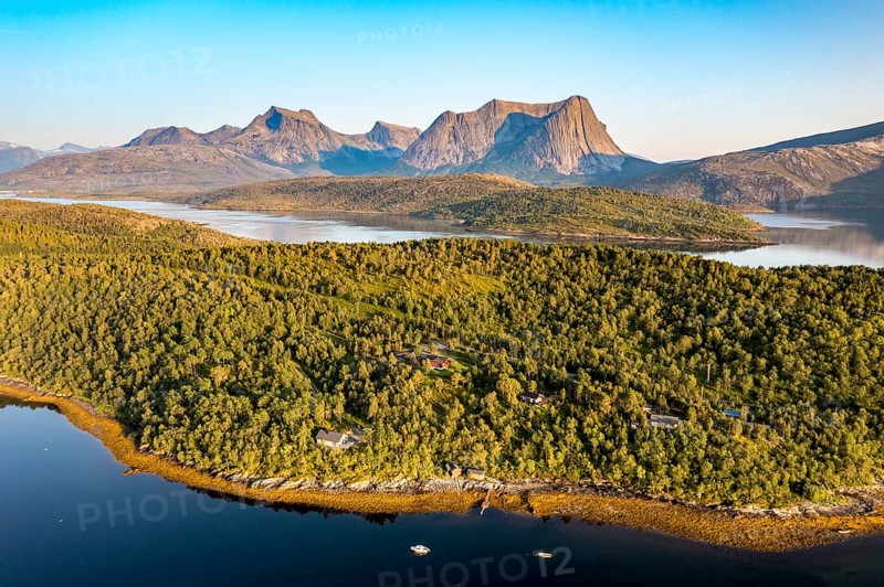 Aerial view over the fjord Efjord south of Narvik, seen at sunset, leisure boats anchor, holiday huts, calm sea, Norway, Europe