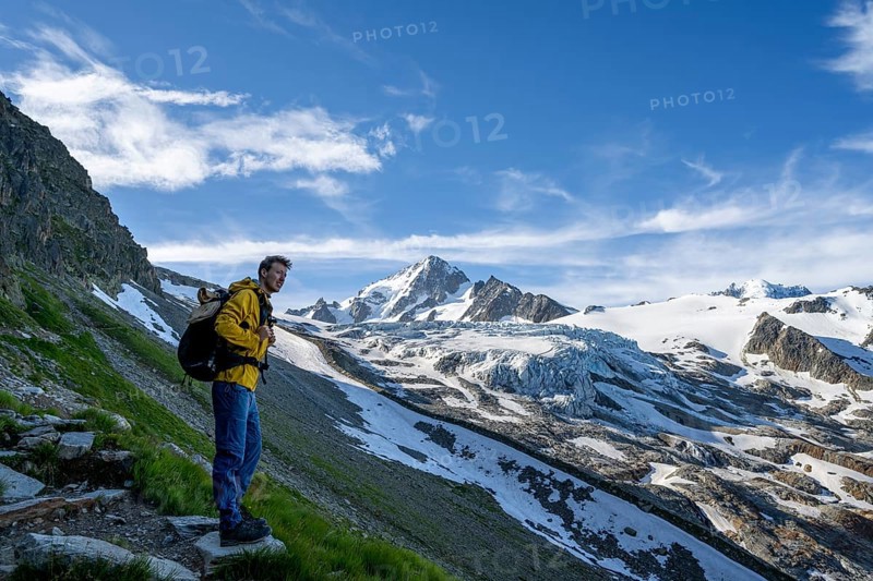 Mountaineer in front of high alpine mountain landscape, summit of the Aiguille de Chardonnet and Glacier du Tour, glacier and mountain peak, Chamonix, Haute-Savoie, France, Europe