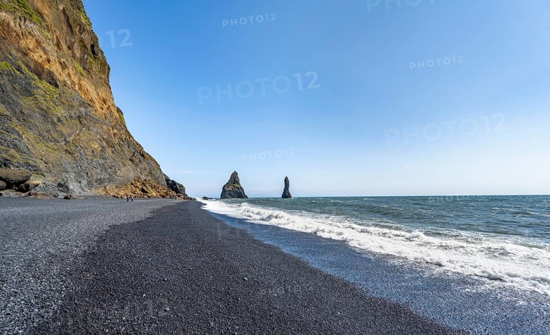 Black beach with cliffs, rock Reynisdrangar in the water, at Reynisfjara beach, Vik, South Iceland, Iceland, Europe