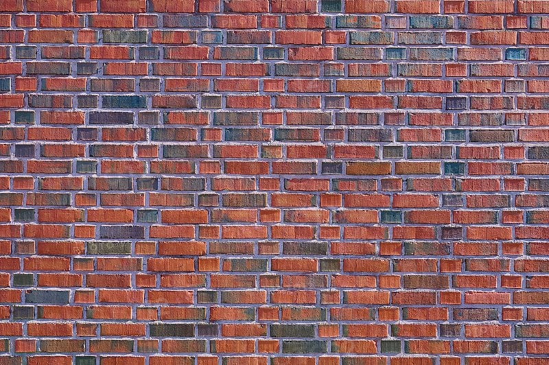 Detailed view of a brick wall with red and brown bricks forming a regular pattern, Bergen, Vestland, Norway, Europe