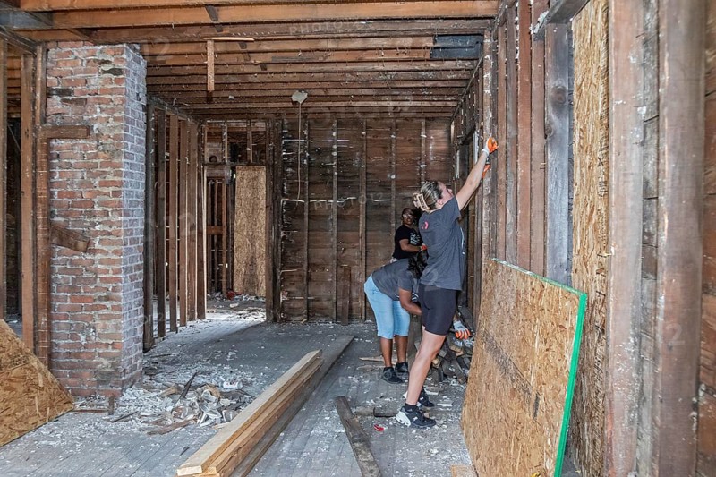 Detroit, Michigan, NW Goldberg Cares, a nonprofit community development corporation, rebuilds a neglected old house in the NW Goldberg neighborhood. Volunteers from Rocket Mortgage helped with the work