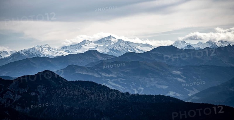 View of the Alpine foothills and the main Alpine ridge with snow-covered peaks, from the Austrian Schinder, Bavarian Alps, Mangfall mountains, Bavaria, Germany, Europe