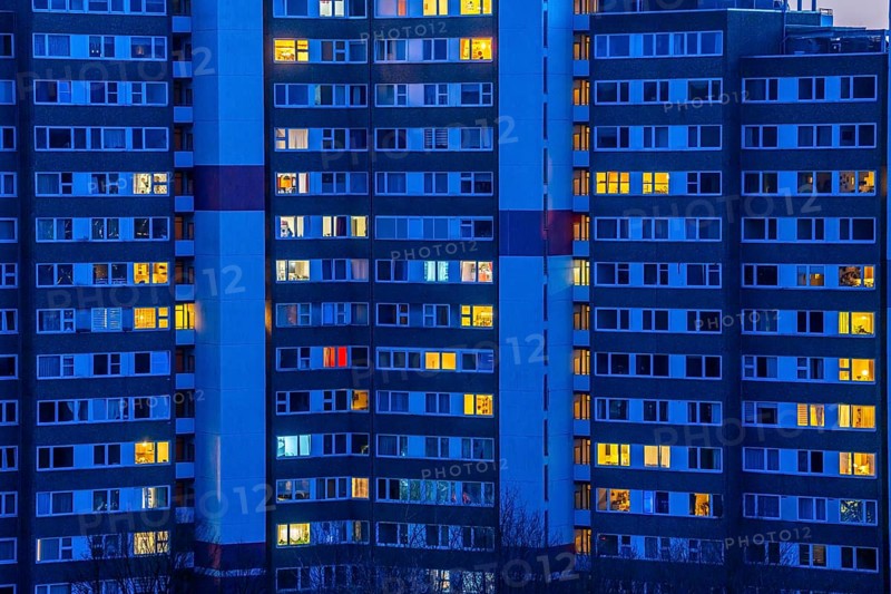 High-rise buildings in the Bensberg residential park, Bergisch-Gladbach, 18-storey housing estate with over 900 flats spread over 7 building complexes, dusk, illuminated windows, North Rhine-Westphalia, Germany, Europe