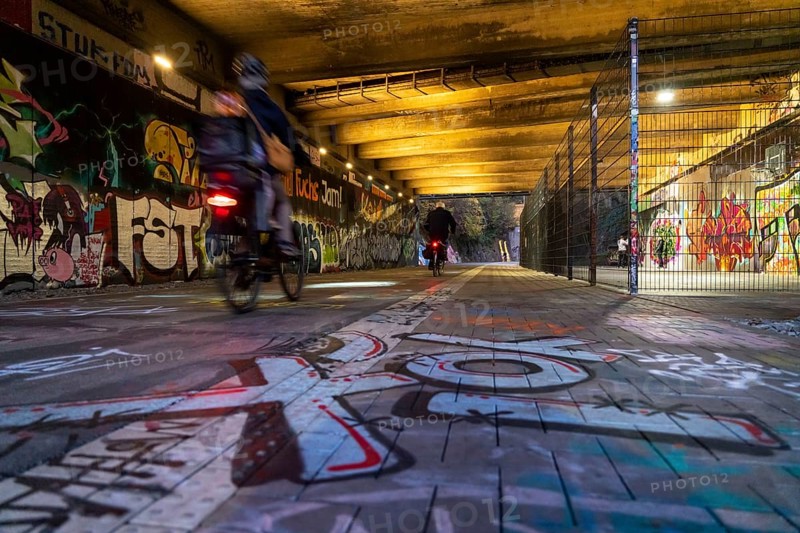 The Nordbahntrasse, a cycle path, footpath, on a former 22 km long railway line, along the west-east axis of Wuppertal, on the northern slope, with many tunnels, viaducts and views of the city, graffiti and basketball area at Brill, Wuppertal, North Rhine-Westphalia, Germany, Europe