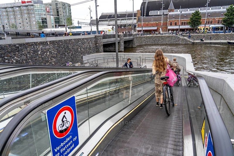 New bicycle car park at Amsterdam Central Station, Stationsplein, space for around 7000 bicycles, largest in Amsterdam, digitally monitored, underground, direct connection to the station and metro, Netherlands, escalators lead to the bicycle garage, Netherlands