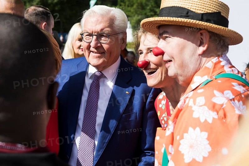 Frank-Walter Steinmeier (President of the Federal Republic of Germany) has his photo taken with two clowns at the Federal President's Citizens' Festival in the Bellevue Palace Gardens, Berlin, 14/09/2024