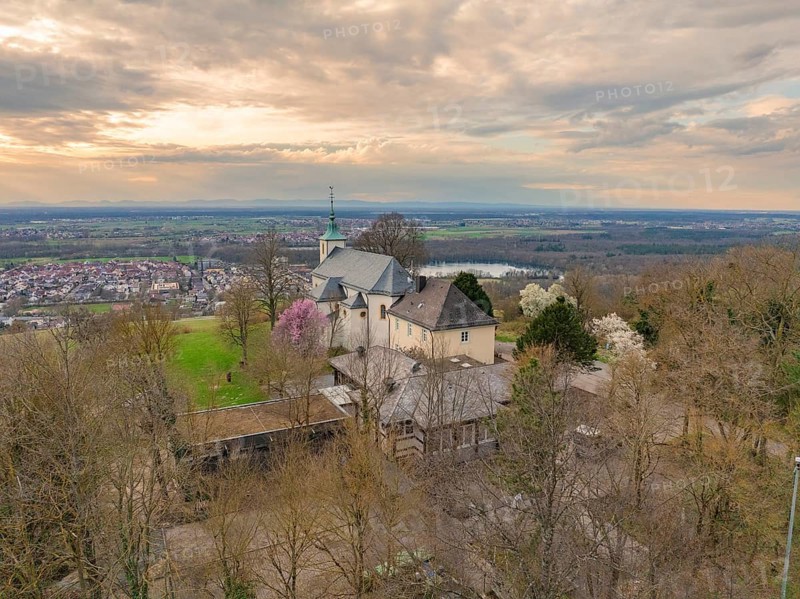 Panoramic view of a church with a view of the village and a cloudy landscape in the background, Michelsberg, Bad Münstereifel