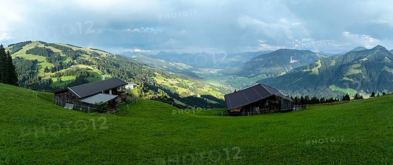Alpine huts, view over the Brixen Valley with rainbow, Hochbrixen, Brixen im Thale, Kitzbühel Alps, Tyrol, Austria, Europe