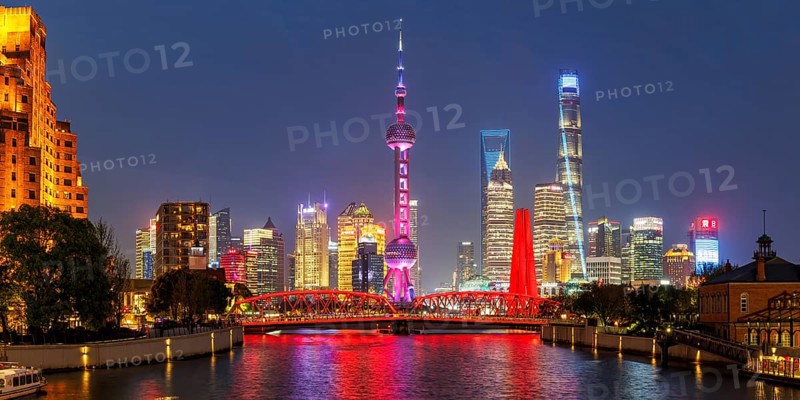 Shanghai skyline at the Bund with Oriental Pearl Tower city centre downtown panorama at night in Shanghai, China, Asia
