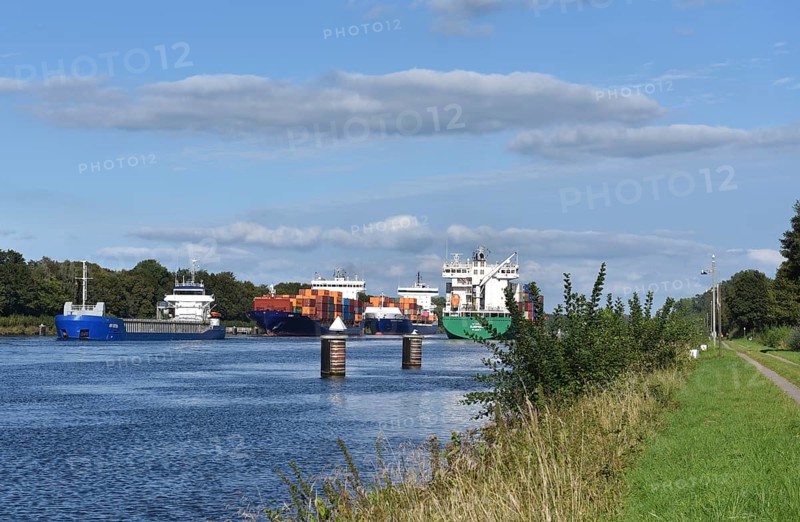 Cargo ship and container ship meet in the Kiel Canal, Kiel Canal in a ship siding, Schleswig-Holstein, Germany, Europe