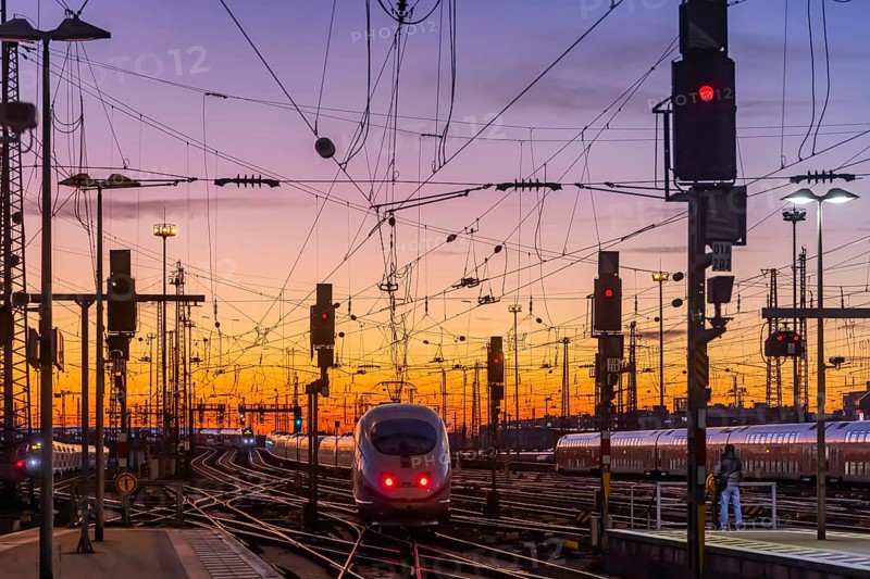 Track apron with ICE in the evening with sunset. Frankfurt am Main main station with rails, line mast and signalling systems. Symbolic photo for the infrastructure of Deutsche Bahn AG. Frankfurt am Main, Hesse, Germany, Europe