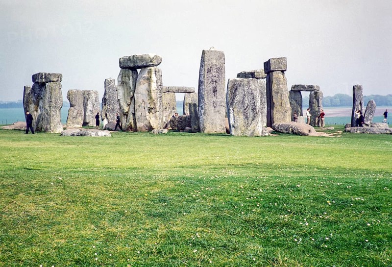 People exploring the standing stones at the Neolithic site of Stonehenge, Wiltshire, England, UK 1961
