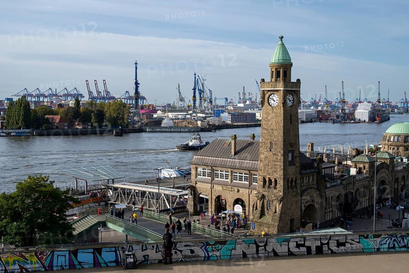 Clock tower, Landungsbrücken, harbour cranes in the harbour behind, St. Pauli, Hamburg, Germany, Europe