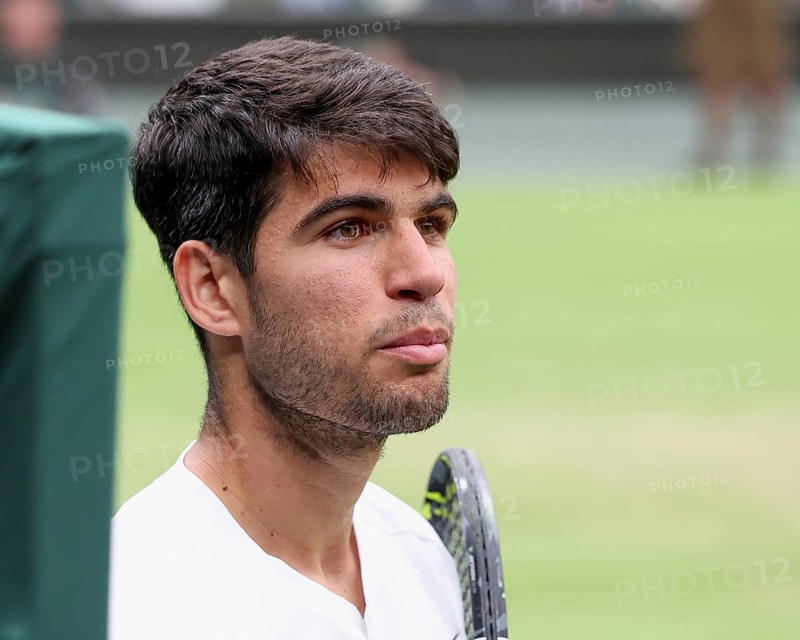 Spanish tennis player Carlos Alcaraz looking at his coach on the centre court at the 2024 Wimbledon Championships, London, England, United Kingdom, Europe