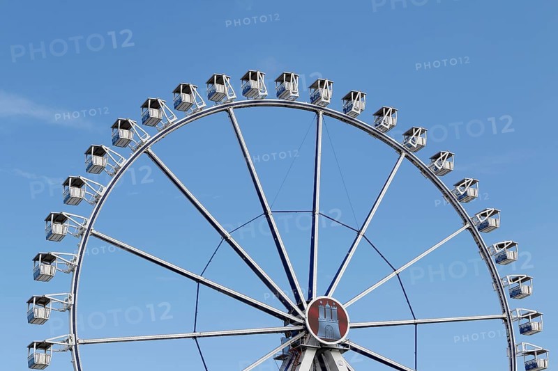 Ferris wheel with Hamburg city coat of arms against a blue sky in summer on Hamburg Cathedral, Heiligengeistfeld, Hamburg, Germany, Europe