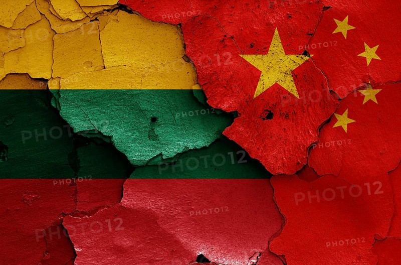 Flags of Lithuania and China painted on cracked wall