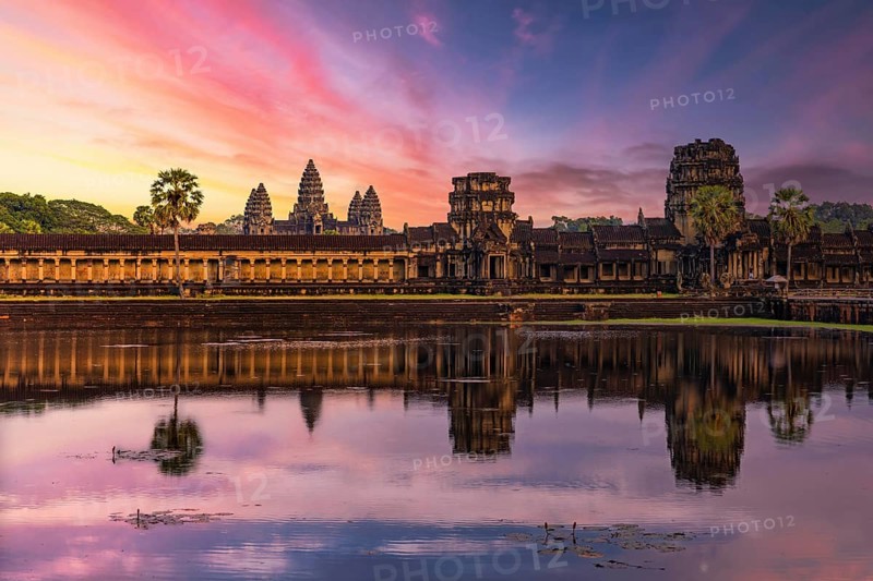 Panorama of Angkor Wat temple reflecting in water at sunset near Siem Reap, Cambodia, Asia