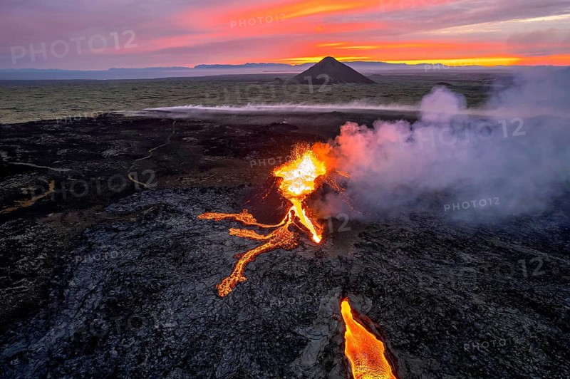 Drone image of a volcanic eruption in the evening light in Grindavik, Sudurnes, Iceland, Europe