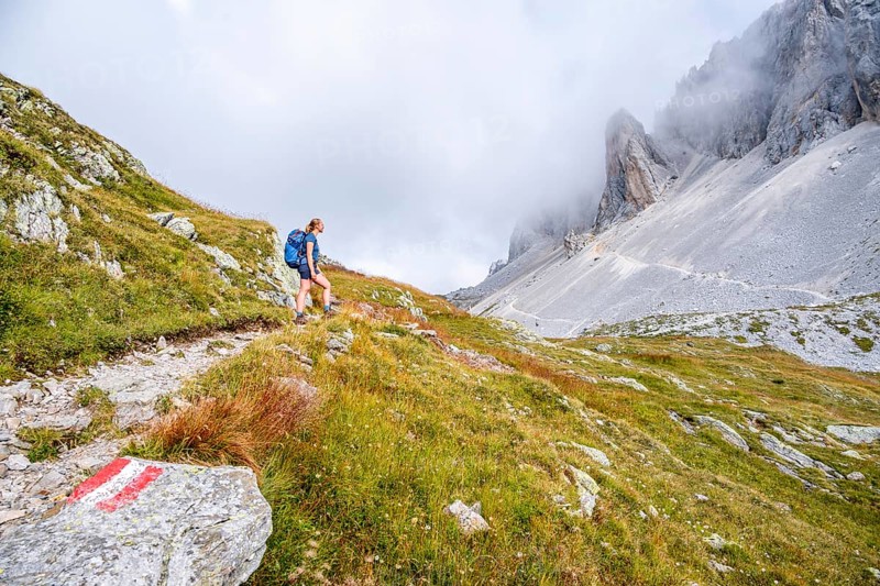 Hiker on the ascent to the Great Kinigat, Carnic Main Ridge, Carnic High Trail, Carnic Alps, Carinthia, Austria, Europe
