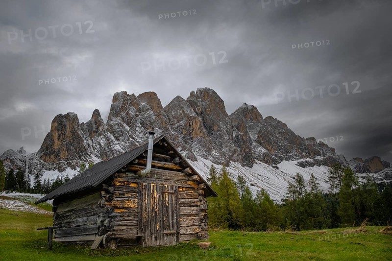 View of a part of the Geisler group from the Gampenwiese, in the foreground an alpine hut, Dolomites, snow, Puez-Geisler nature park Park, St. Magdalena, Funes, Villnößtal, South Tyrol, Italy, Europe