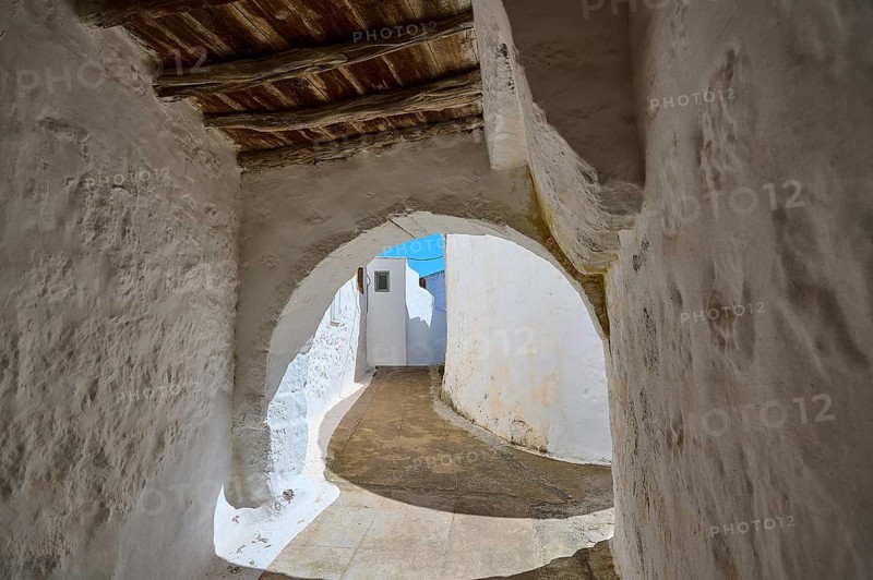 Arched passageway with wooden ceiling and white walls in a historic building, Chora, main town of Patmos, Patmos, Old Town, Dodecanese, Greek Islands, Greece, Europe
