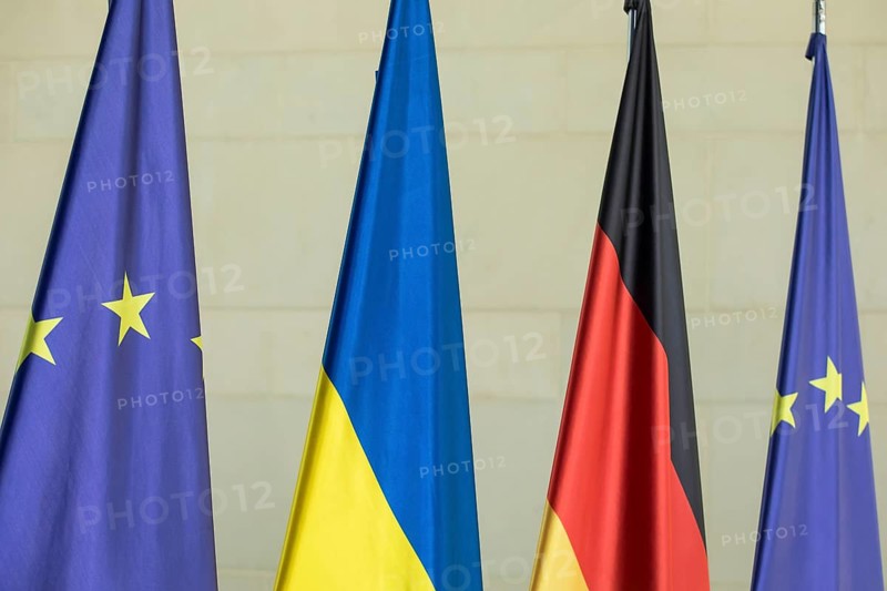 Flags of the European Union (EU), Ukraine and the Federal Republic of Germany in front of the joint press statement by Volodymyr Zelensky (President of Ukraine) and Olaf Scholz (Chancellor of the Federal Republic of Germany) at the Federal Chancellery, 11 October 2024
