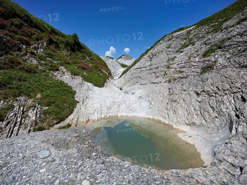 Glacier mill with glacier pots on the Trinser Alp Mora, Trin, Canton Graubünden, Switzerland, Europe