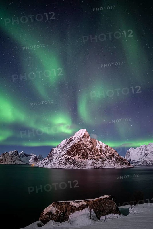 Green northern lights reflected in fjord, steep mountains, aurora borealis, winter, Reine, Moskenesoya, Lofoten, Norway, Europe