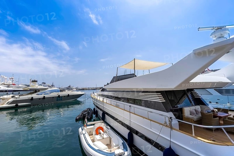 France, French Riviera, Monte Carlo marina with luxury yachts and cars in Monaco bay, Europe
