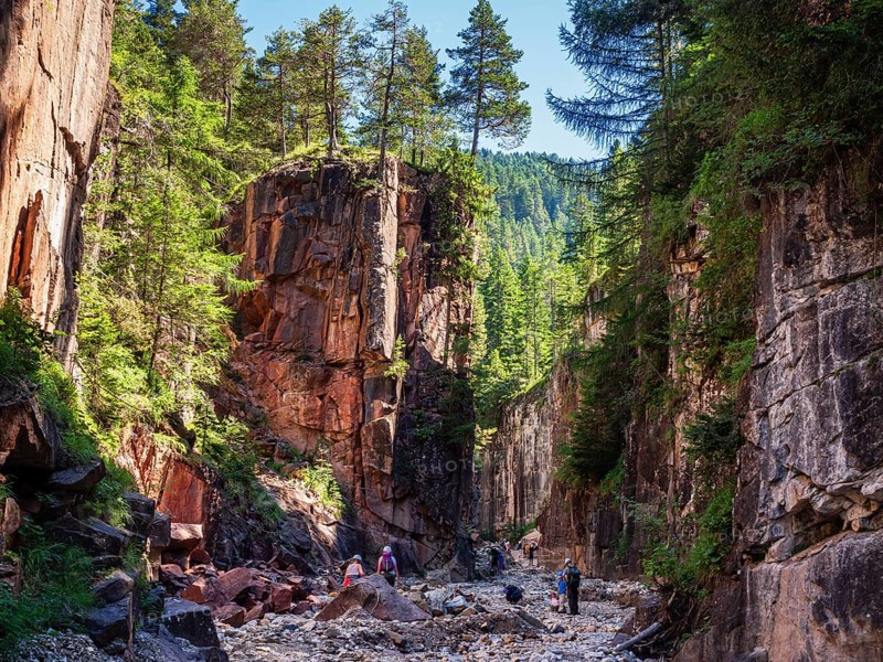 GEOPARC Bletterbach canyon, layers of sediments, stratum, people hike inside the gorge, Aldein, south Tyrolia, Italy, Europe