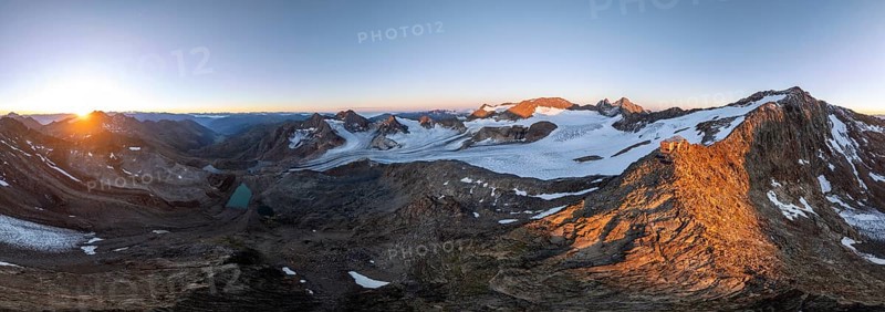 Atmospheric sunrise in a picturesque mountain landscape, alpenglow, aerial view, mountain hut Becherhaus at the summit Becher and glacier Übeltalferner, Stubai Alps, South Tyrol, Italy, Europe