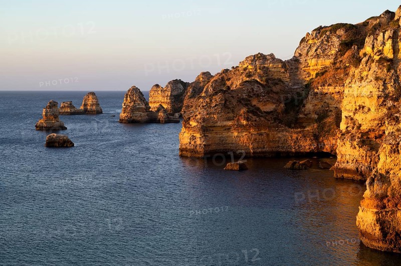Colourful cliffs and rocks at sunrise on the beach, Praia da Dona Ana, Lagos, cliffs, Atlantic Ocean, Algarve, Portugal, Europe