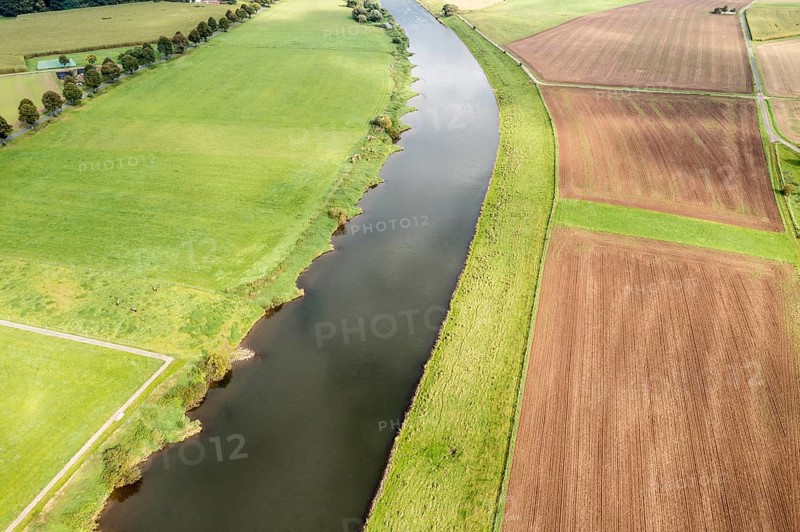 Aerial view over fields and meadows at the Weser river, east of village Wahmbeck, Weserbergland, Germany, Europe