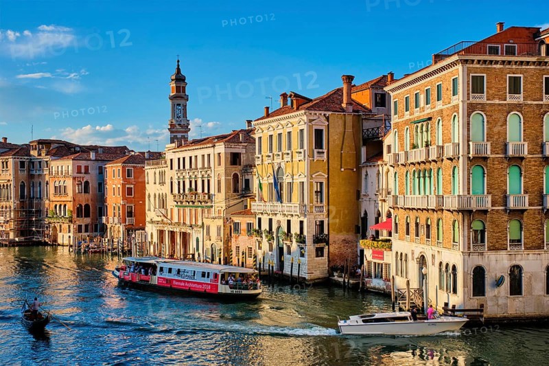 VENICE, ITALY, JUNE 27, 2018: Grand Canal with boats, vaporetto and gondolas on sunset from Rialto bridge, Venice, Italy, Europe