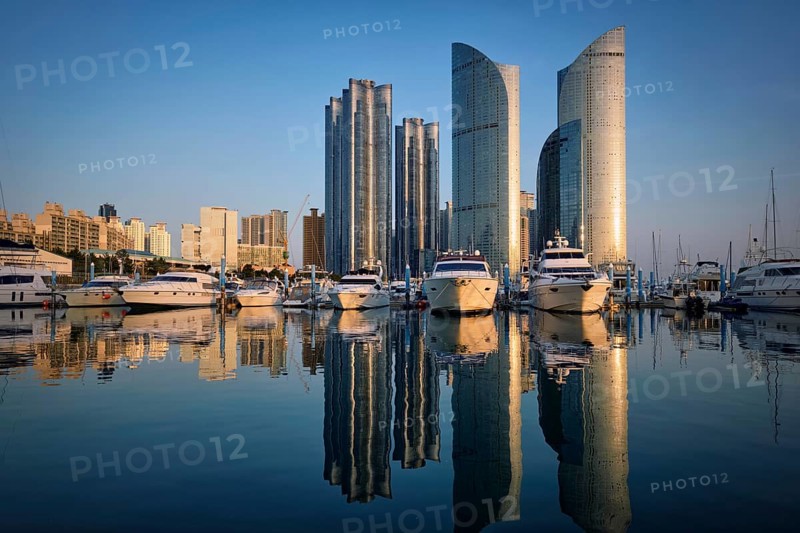 Busan marina with yachts, Marina city skyscrapers with reflection on sunset, South Korea, Asia