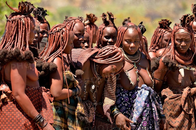 Mourning Himba women at a funeral, the widow in the middle, Omohanja, Kaokoland, Kunene, Namibia, Africa